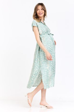 אישה לובשת שמלת הריון ליהיא שמנת מרווה של אבישג ארבל