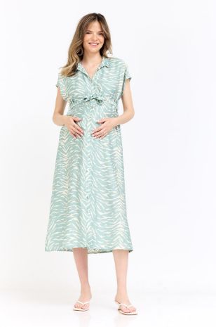 אישה לובשת שמלת הריון ליהיא שמנת מרווה של אבישג ארבל